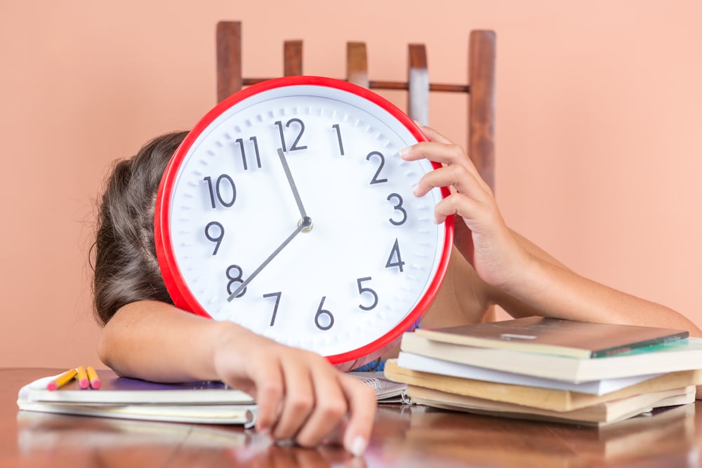 Tired child sleeping and holding a clock Depositphotos 26724985 m 2015
