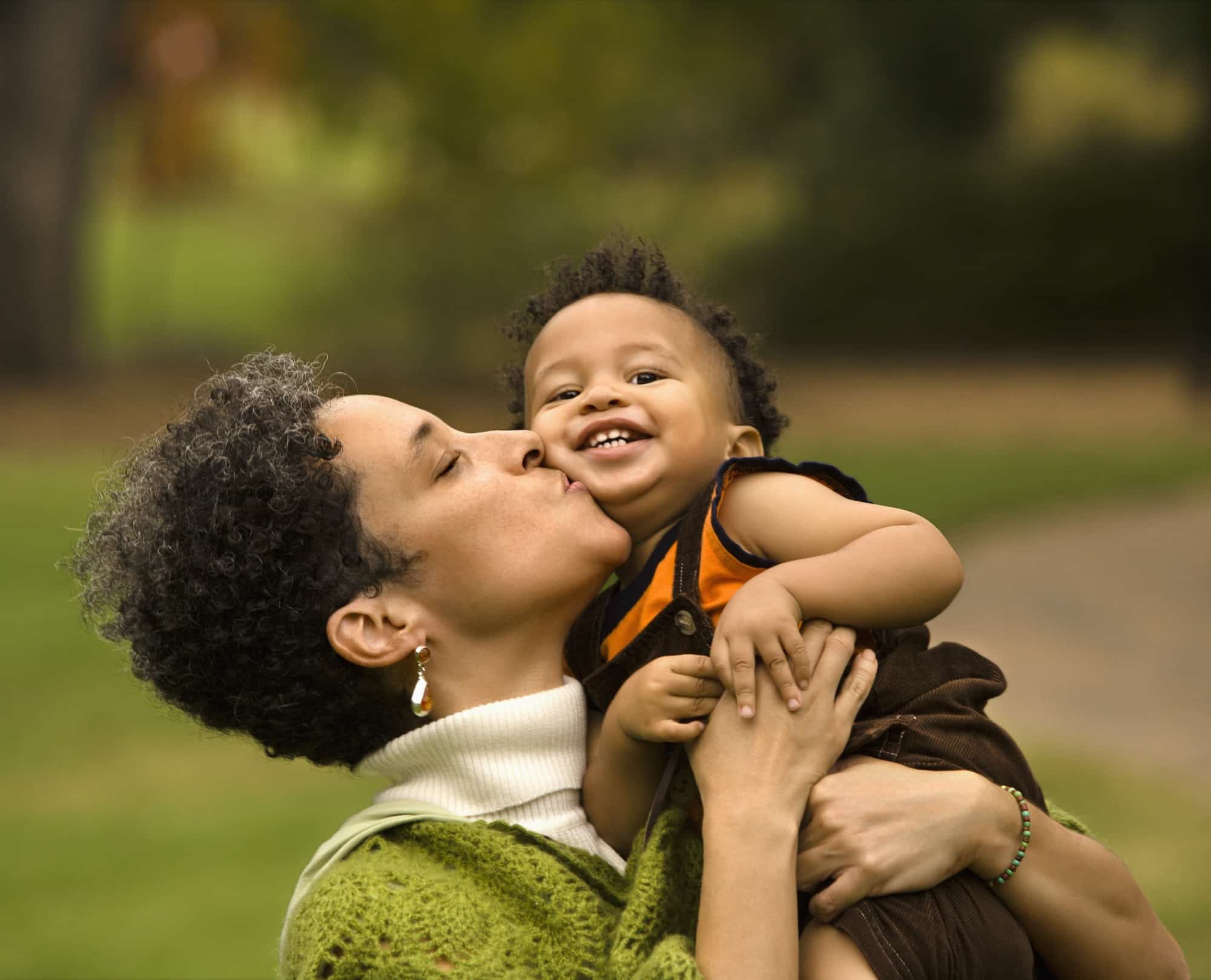 Woman kissing boy Depositphotos 9309423 l 2015